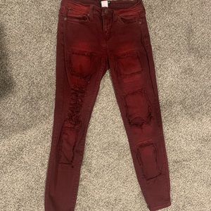 Distressed burgundy/red skinny jeans, size 1